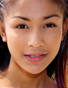 Cute young brown eyed ladyboy